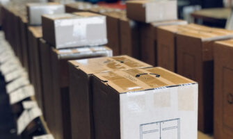 Things are packed in a cargo boxes that are ready to to be shipped.